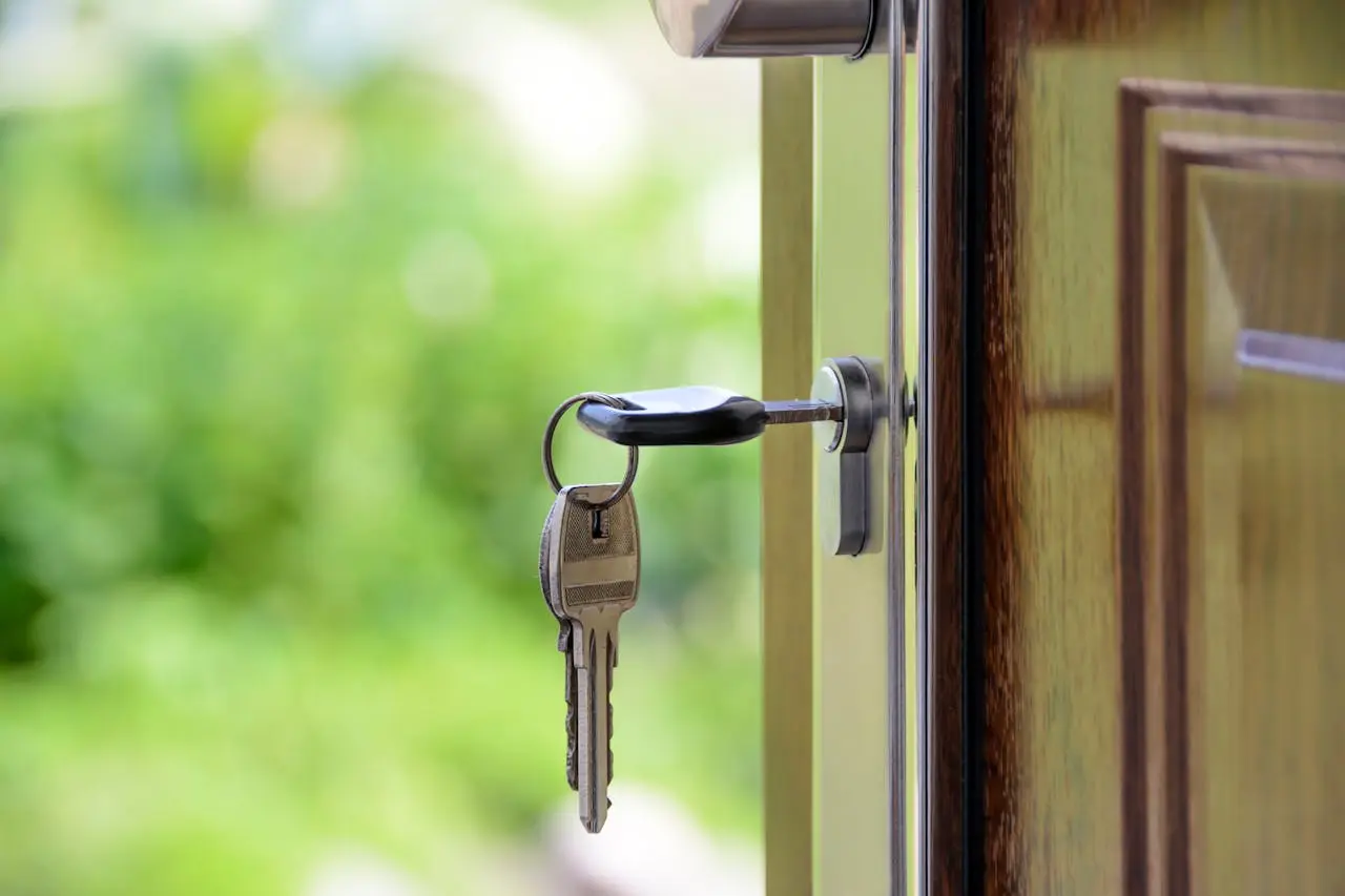 a door with a pair of keys on the keyhole