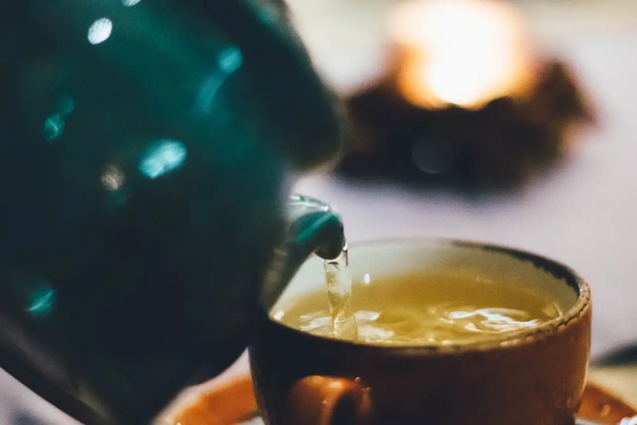 from the perspective of a person who is serving some tea